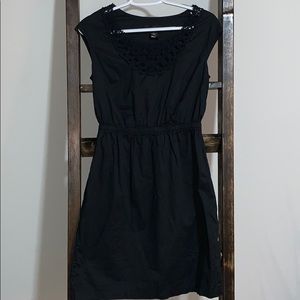 Black cap-sleeve dress with crochet neckline